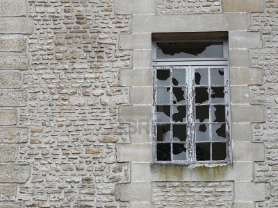 4014776-broken-windows-in-a-derelict-stone-building